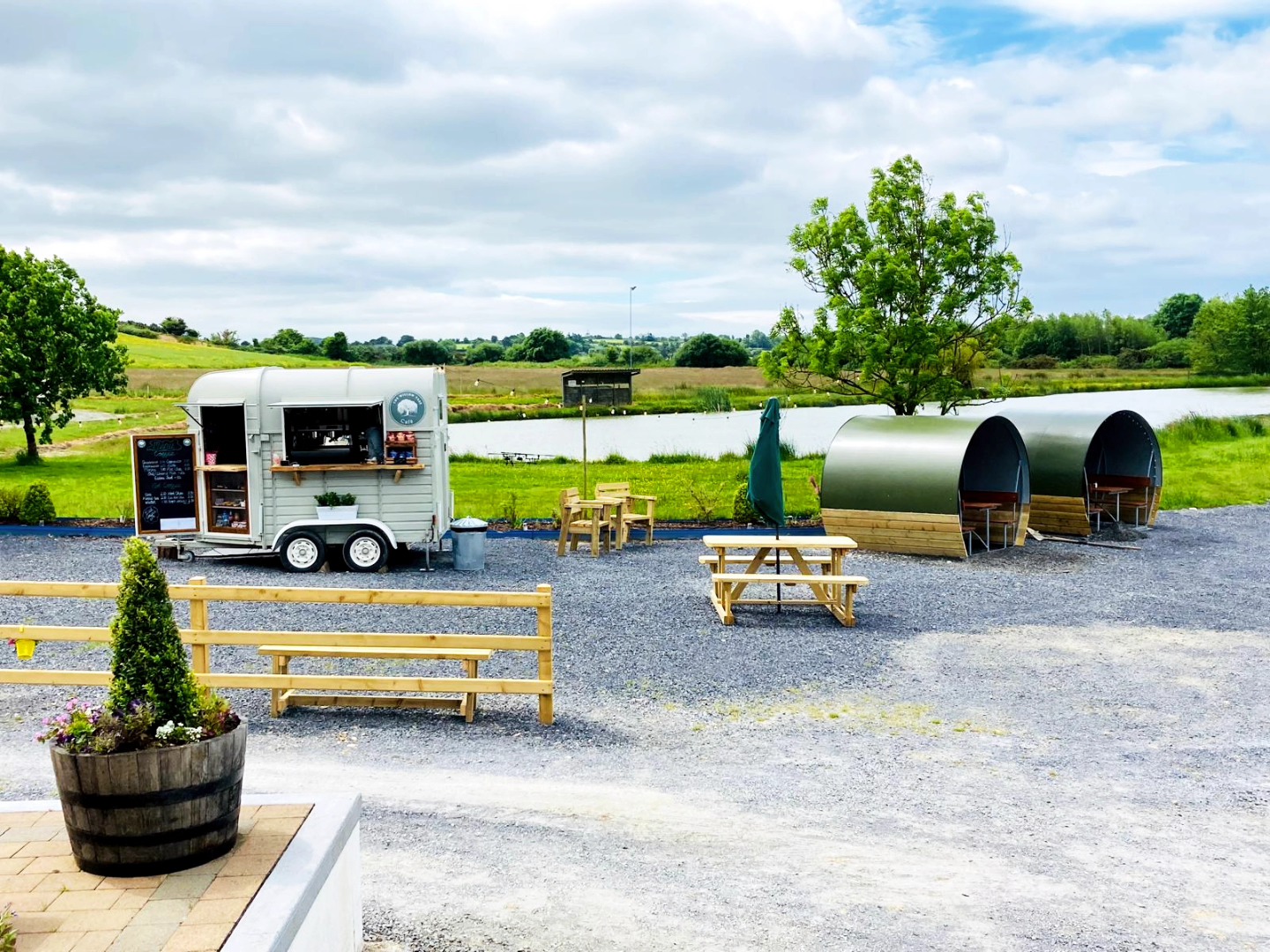 The Willow Tree Café horsebox and seating pods overlooking the lake at Loch Mahon