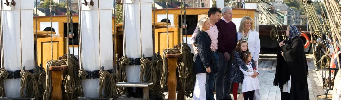 Visitors exploring the deck of the Dunbrody Famine Ship