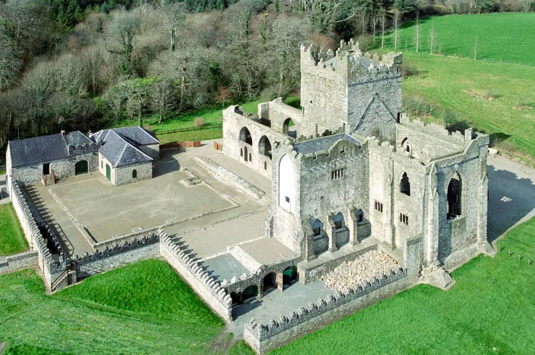 Aerial view of the stone ruins and grounds of Tintern Abbey